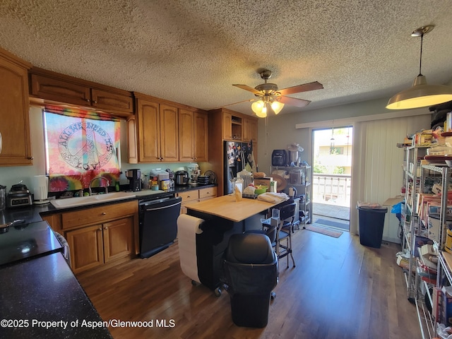 27461/2 Laguna Dr, Grand Junction, CO 81503 - kitchen with brown cabinets, wood finished floors, a ceiling fan, a sink, and black appliances