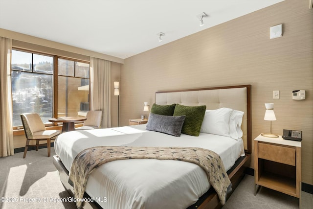 bedroom featuring carpet flooring and wallpapered walls