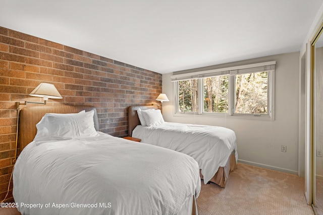 625 S W End St Unit 12, Aspen, CO 81611 - bedroom featuring multiple windows, brick wall, and carpet flooring