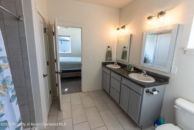1149 E 17th St, Rifle, CO 81650 - bathroom with double vanity, ensuite bathroom, tile patterned flooring, and curtained shower