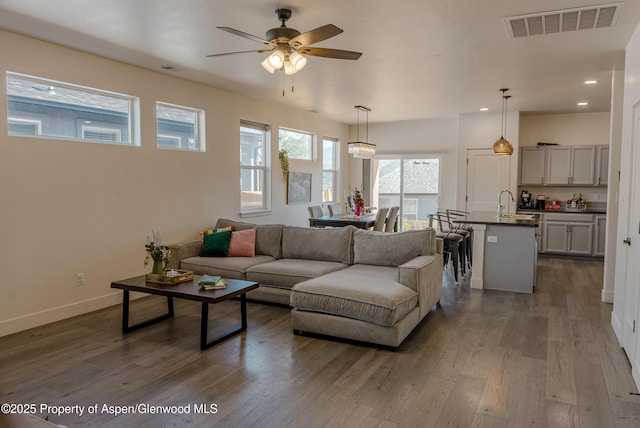 1149 E 17th St, Rifle, CO 81650 - living room featuring a ceiling fan, recessed lighting, and dark wood-style flooring