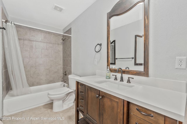 bathroom with tile patterned floors, vanity, toilet, visible vents, and shower / bath combination with curtain