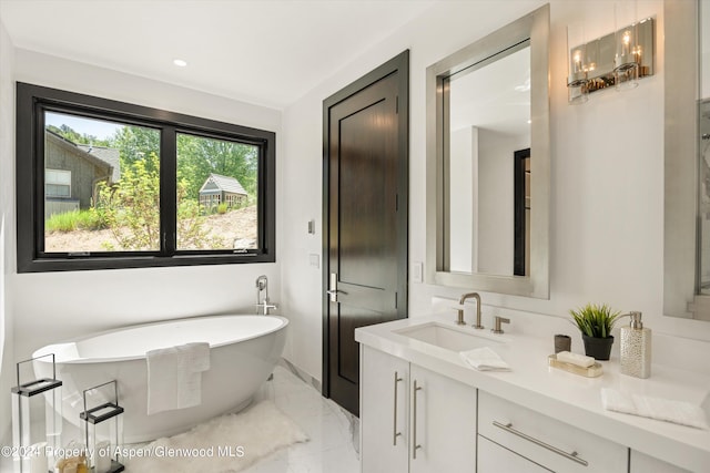 bathroom with a bathtub and vanity