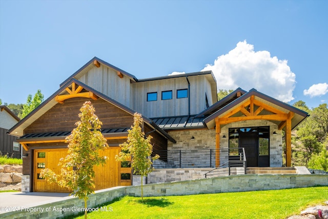 view of front of home featuring a garage and a front lawn