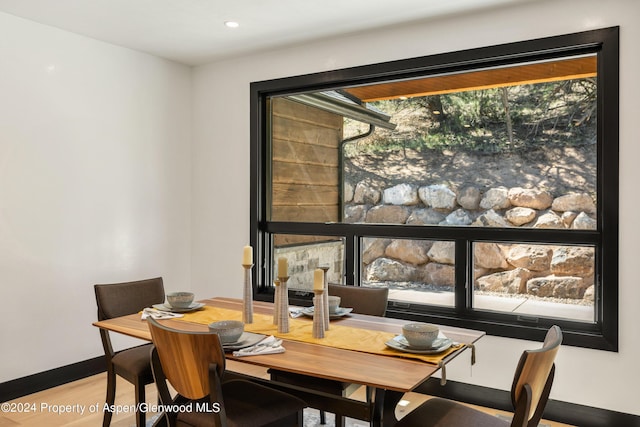 dining area with hardwood / wood-style floors