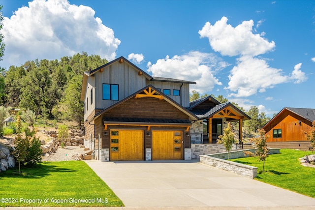 view of front of property featuring a garage and a front yard