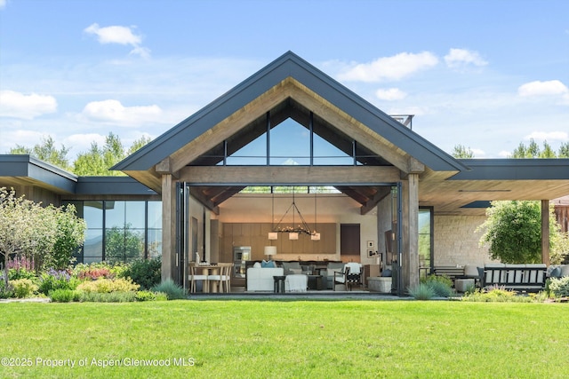 33 St Finnbar Farm Rd, Carbondale, CO 81623 - back of house featuring an outdoor hangout area and a yard