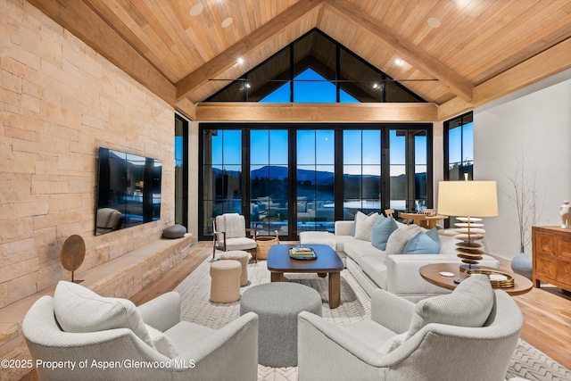 33 St Finnbar Farm Rd, Carbondale, CO 81623 - living area featuring high vaulted ceiling, a wooden ceiling with exposed beams, and wood finished floors