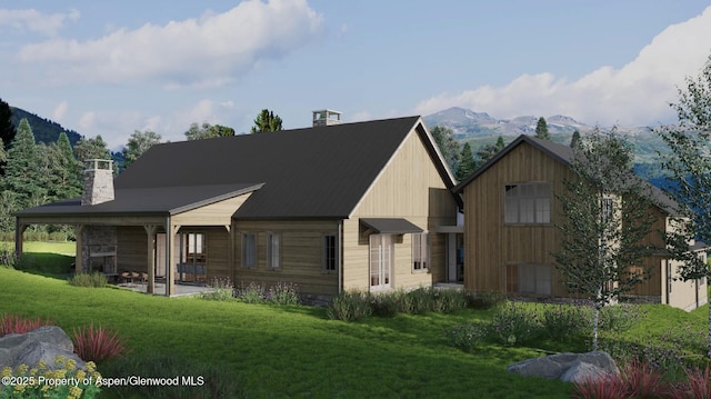 325 Holland Hills Rd, Basalt, CO 81621 - rear view of house with a mountain view, a chimney, a yard, and a patio