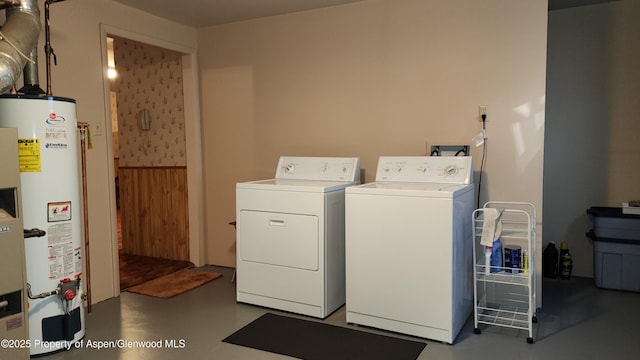 936 Legion St, Craig, CO 81625 - clothes washing area featuring washer and dryer, laundry area, and water heater