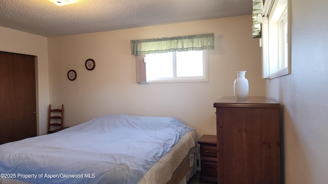 936 Legion St, Craig, CO 81625 - bedroom featuring a textured ceiling