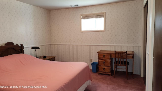936 Legion St, Craig, CO 81625 - carpeted bedroom with a wainscoted wall, wallpapered walls, and visible vents