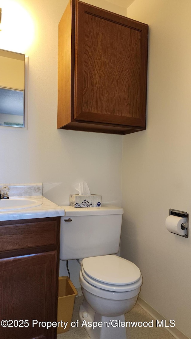 936 Legion St, Craig, CO 81625 - bathroom with toilet, baseboards, and vanity
