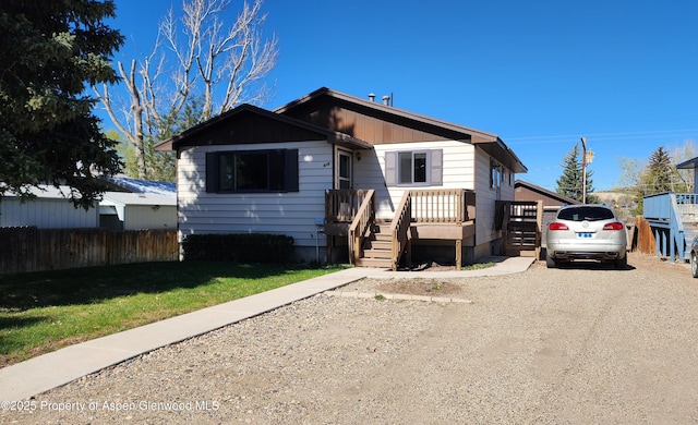 936 Legion St, Craig, CO 81625 - bungalow with fence, dirt driveway, and a front yard