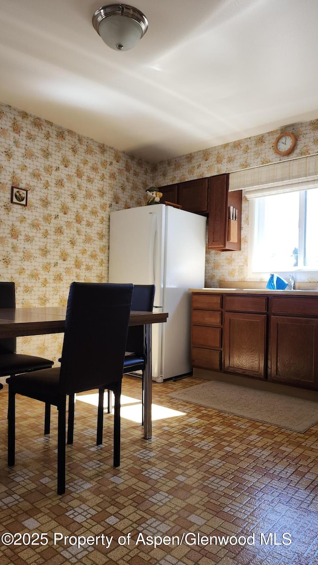 936 Legion St, Craig, CO 81625 - dining area with wallpapered walls