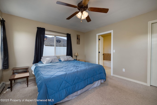 165 Harris Ln, Parachute, CO 81635 - bedroom featuring light carpet, ensuite bath, a ceiling fan, and a baseboard heating unit