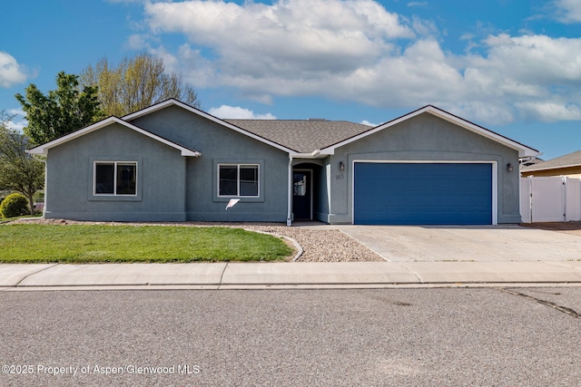 165 Harris Ln, Parachute, CO 81635 - single story home featuring an attached garage, driveway, and stucco siding