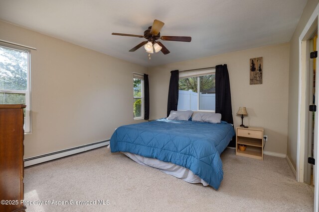 165 Harris Ln, Parachute, CO 81635 - carpeted bedroom with a baseboard radiator and ceiling fan