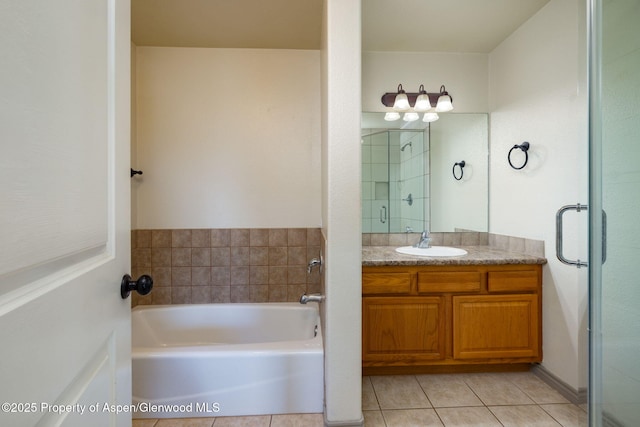 165 Harris Ln, Parachute, CO 81635 - bathroom featuring vanity, a garden tub, and tile patterned floors