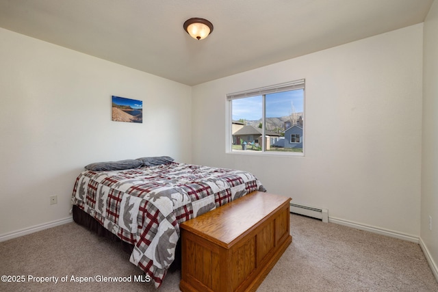 165 Harris Ln, Parachute, CO 81635 - bedroom with a baseboard radiator and carpet