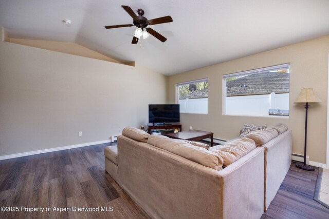 165 Harris Ln, Parachute, CO 81635 - living room with vaulted ceiling, a baseboard radiator, dark wood finished floors, ceiling fan, and a baseboard heating unit