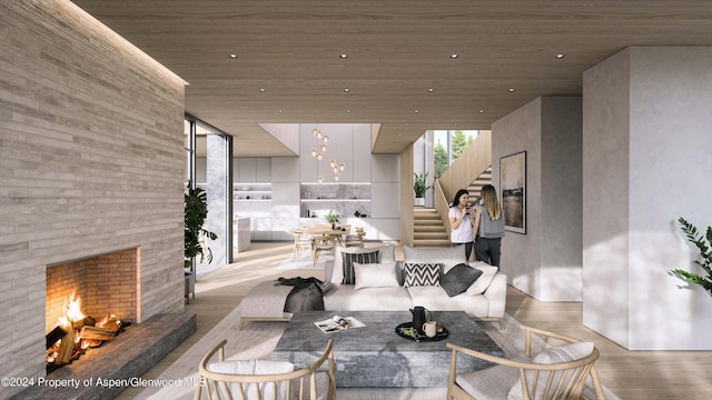 living room featuring light hardwood / wood-style flooring and wooden ceiling