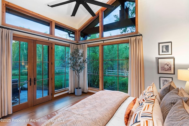236 Bristlecone Dr, Carbondale, CO 81623 - bedroom featuring french doors, access to exterior, high vaulted ceiling, and wood finished floors