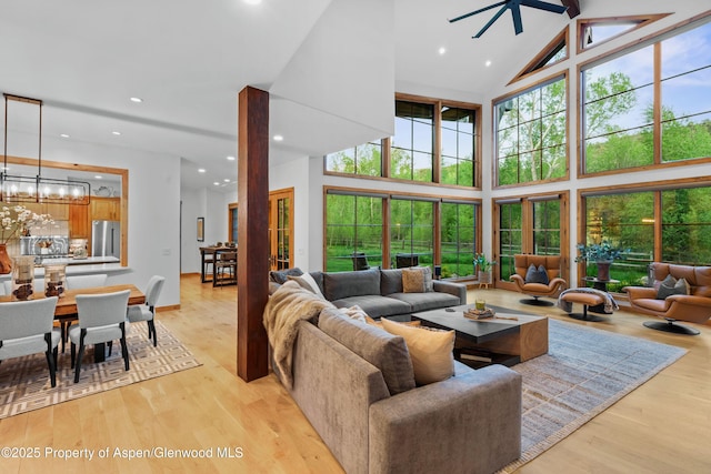 236 Bristlecone Dr, Carbondale, CO 81623 - living room with a towering ceiling, light wood-style flooring, recessed lighting, a chandelier, and a ceiling fan