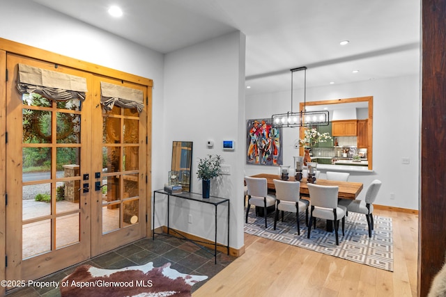 236 Bristlecone Dr, Carbondale, CO 81623 - dining room with french doors, a chandelier, recessed lighting, baseboards, and wood finished floors