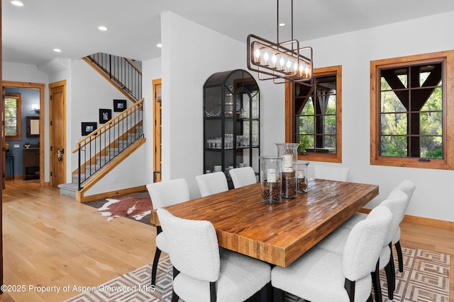 236 Bristlecone Dr, Carbondale, CO 81623 - dining area featuring light wood-type flooring, baseboards, stairs, a chandelier, and recessed lighting
