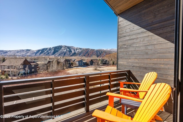 balcony with a mountain view and a residential view