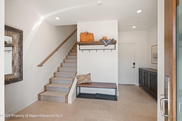 mudroom featuring recessed lighting and baseboards