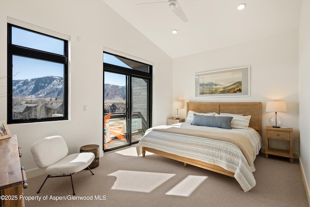 bedroom with a mountain view, lofted ceiling, carpet floors, and access to outside