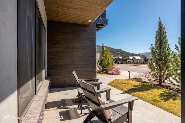 view of patio / terrace featuring a mountain view