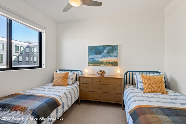 carpeted bedroom featuring ceiling fan