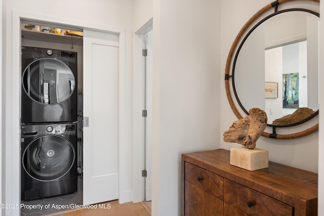 laundry room featuring laundry area and stacked washer and clothes dryer