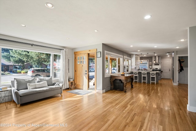 341 Park Dr, Glenwood Springs, CO 81601 - living room featuring recessed lighting, light wood-style floors, and a baseboard heating unit
