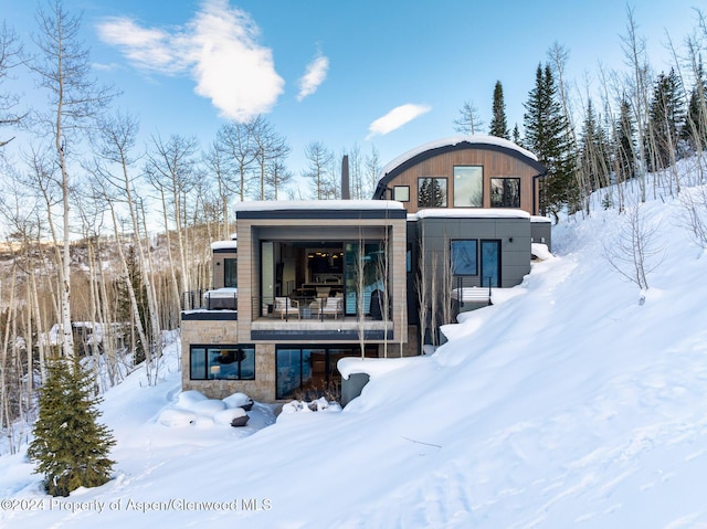 view of snow covered house