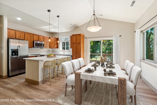 1913 Colorow Rd, Glenwood Springs, CO 81601 - dining space with light wood finished floors, vaulted ceiling, and recessed lighting