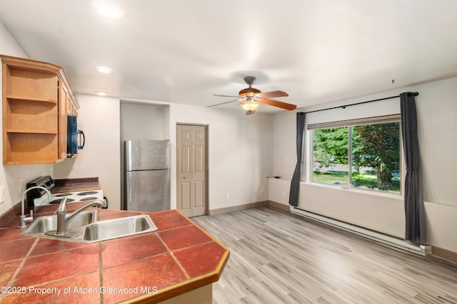 1913 Colorow Rd, Glenwood Springs, CO 81601 - kitchen featuring freestanding refrigerator, white range with electric cooktop, black microwave, baseboard heating, and open shelves