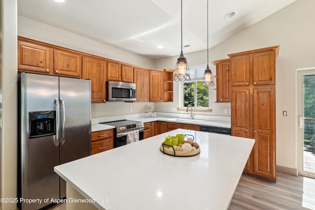 1913 Colorow Rd, Glenwood Springs, CO 81601 - kitchen with stainless steel appliances, light wood-style floors, open shelves, light countertops, and brown cabinetry