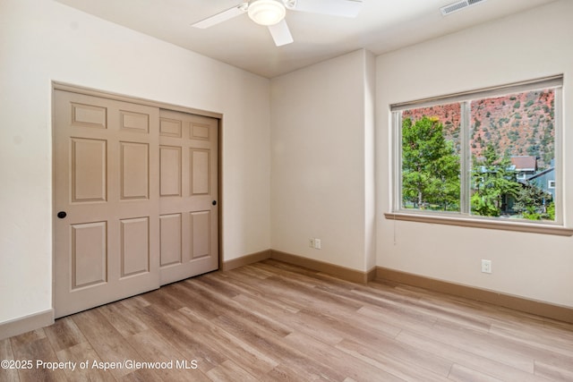 1913 Colorow Rd, Glenwood Springs, CO 81601 - unfurnished bedroom with light wood-style floors, ceiling fan, and a closet