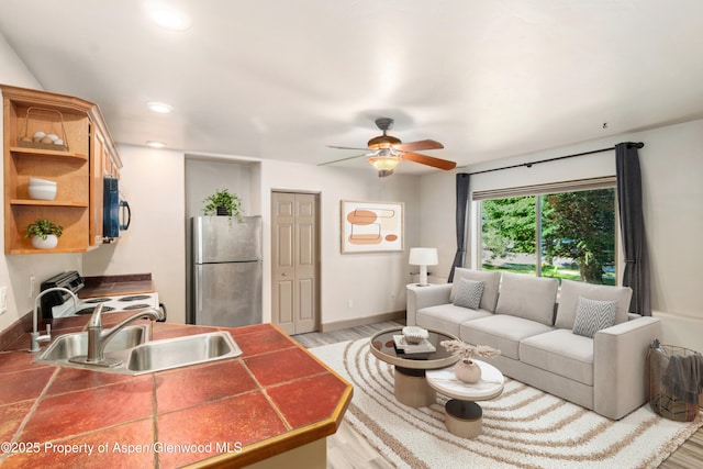 1913 Colorow Rd, Glenwood Springs, CO 81601 - living room featuring a ceiling fan, light wood finished floors, and recessed lighting