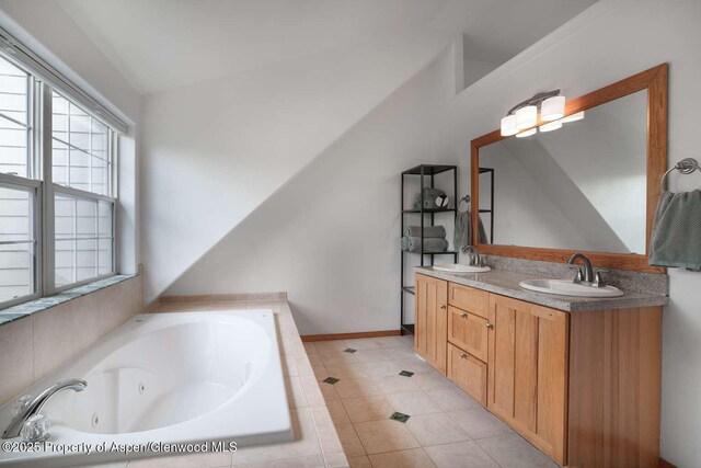 311 Sopris Cir, Basalt, CO 81621 - bathroom featuring a tub with jets, double vanity, and tile patterned flooring