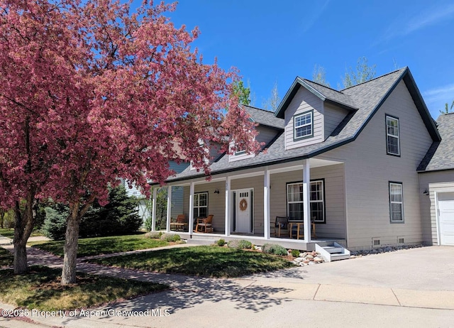 311 Sopris Cir, Basalt, CO 81621 - view of front facade with covered porch, driveway, and roof with shingles