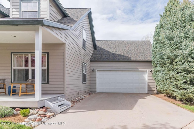311 Sopris Cir, Basalt, CO 81621 - view of property exterior with a porch, roof with shingles, an attached garage, and concrete driveway