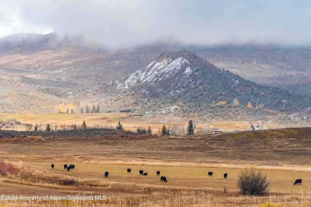 view of mountain feature with a rural view