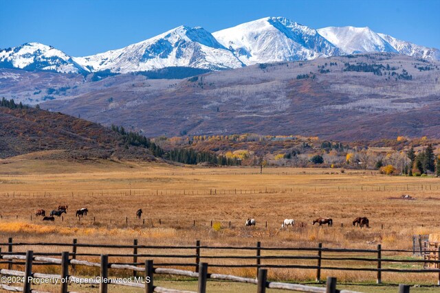 mountain view featuring a rural view