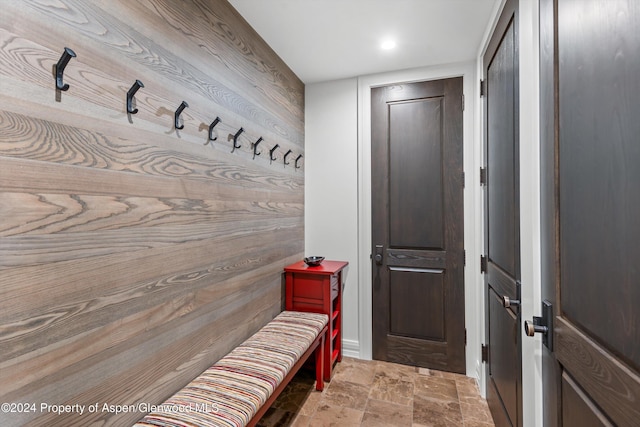 mudroom featuring stone finish floor