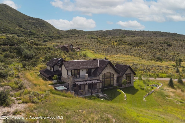 drone / aerial view featuring a mountain view